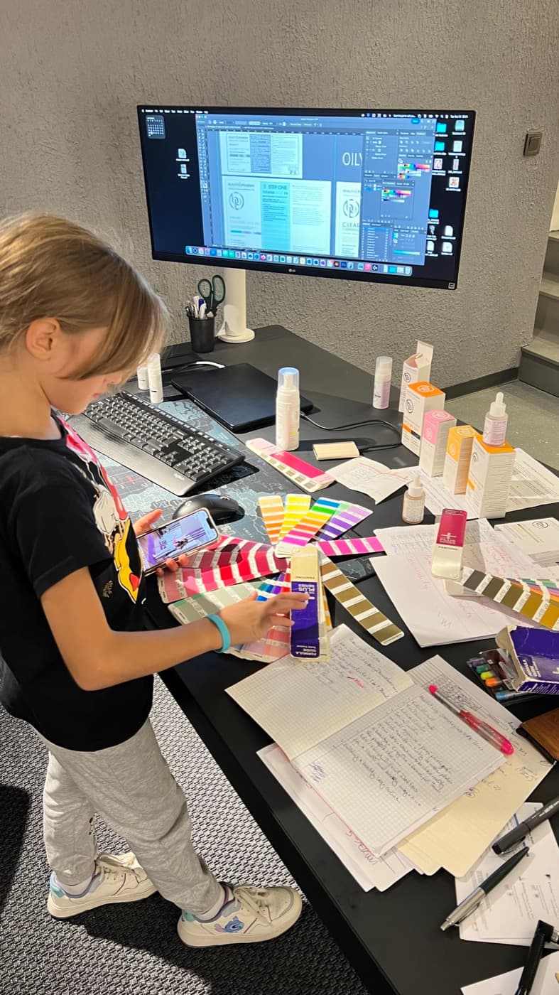 Mark, Tuna and their daughter at the Meier Innovation Lab design desk